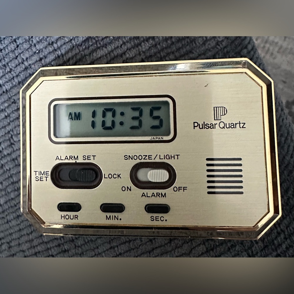 Pocket/travel size clock with alarm.